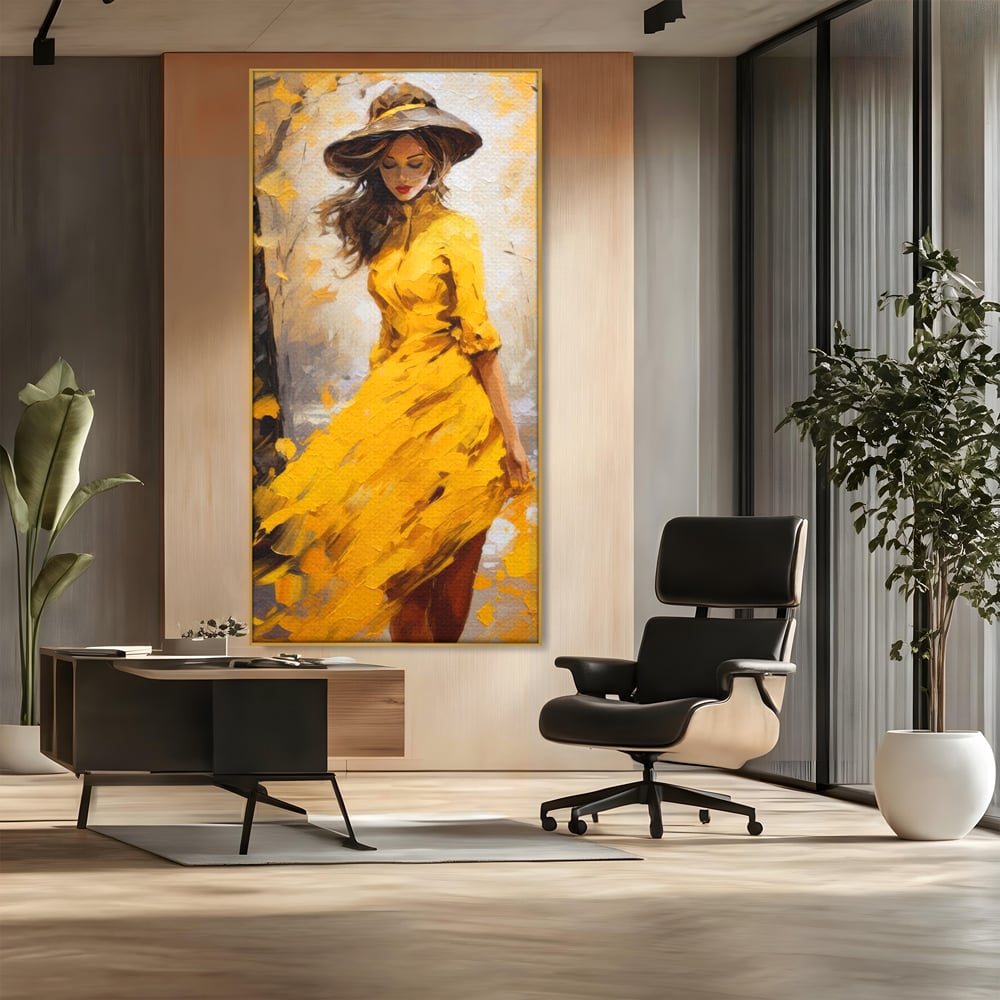 Tablou canvas cu tablou canvas cu femeie in galben, in rama de aluminiu auriu, pe perete intr-un birou